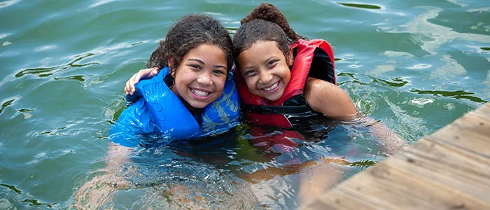 Girls swimming in lake