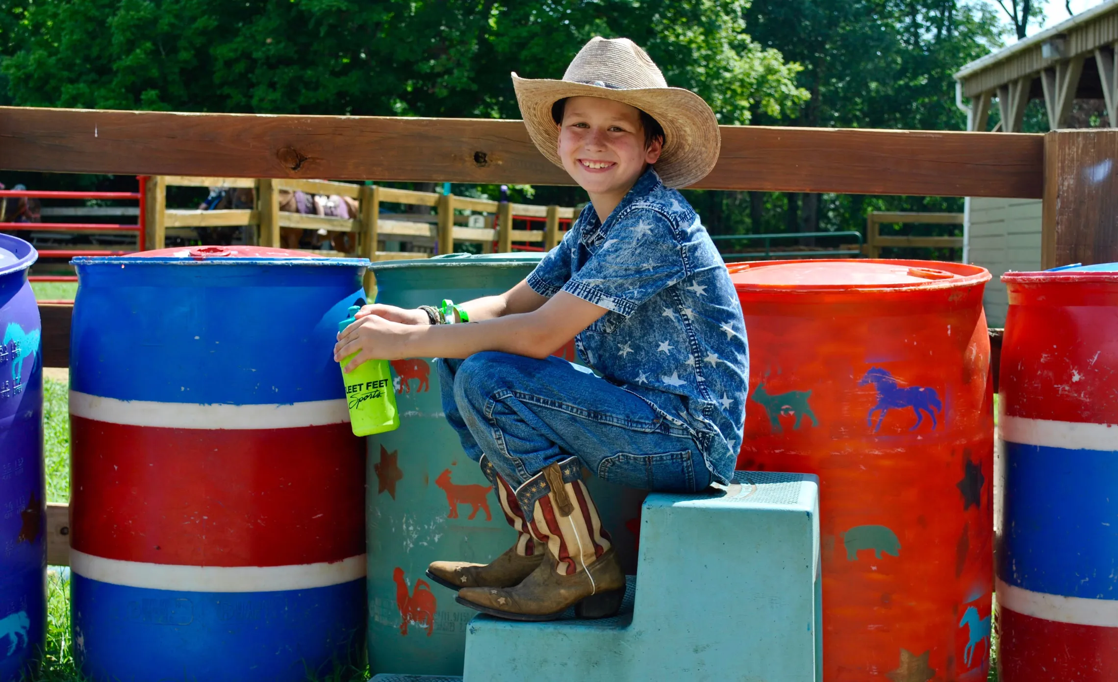 Boy sitting on barrels